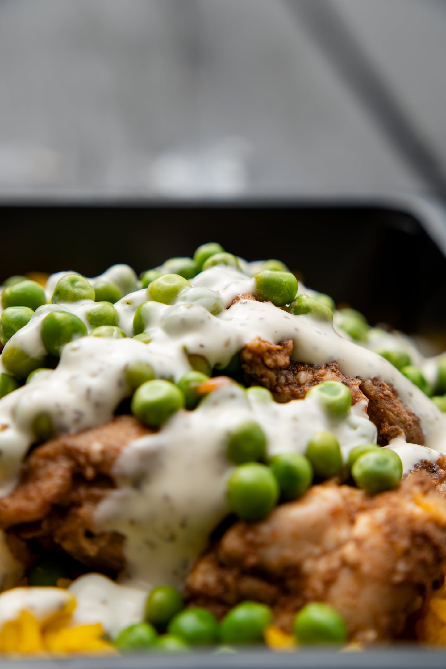 12. Jerk Chicken, Mexican Spicy Rice, Garden Peas, Tzatziki Sauce