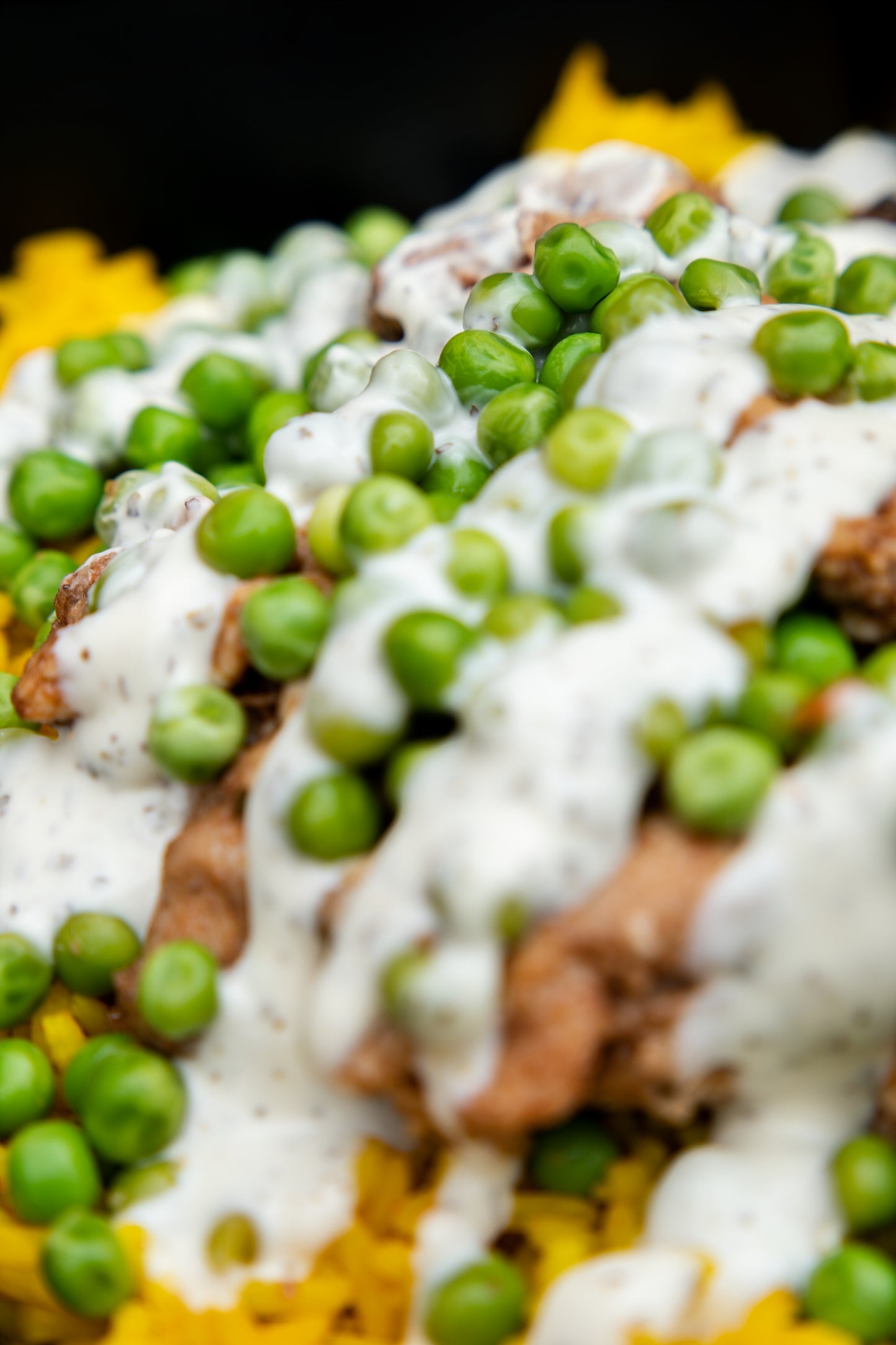 12. Jerk Chicken, Mexican Spicy Rice, Garden Peas, Tzatziki Sauce