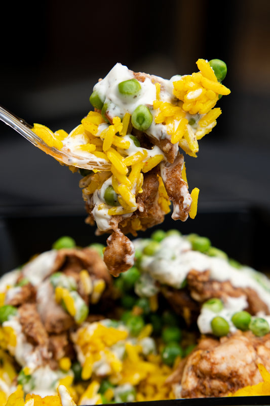 12. Jerk Chicken, Mexican Spicy Rice, Garden Peas, Tzatziki Sauce